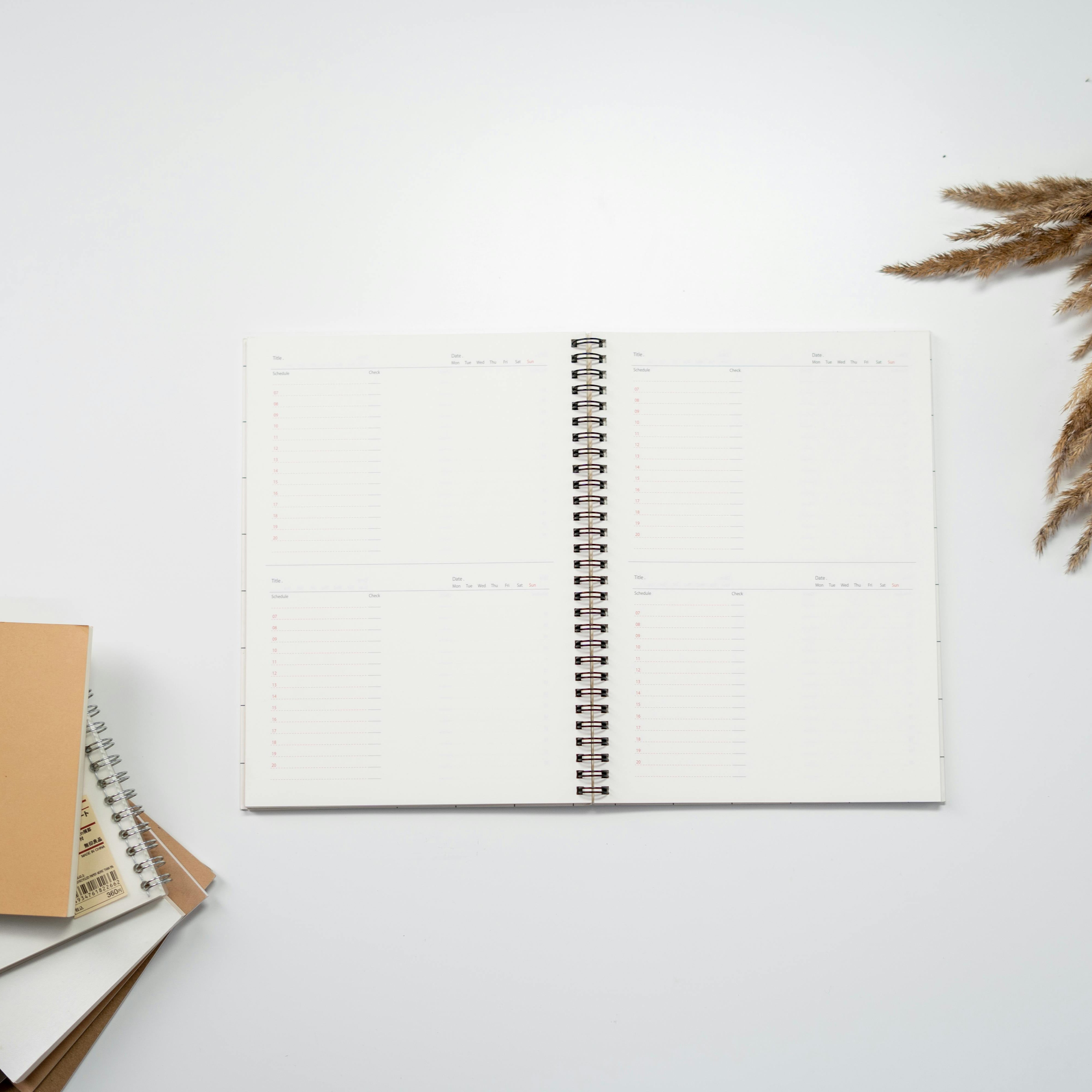 Open notitieboek met ruimte voor nieuwe plannen en inzichten, symbool voor persoonlijke groei en het Coaching Traject.