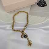 Obsidiaan armband met maan | Uchu Reminders – curated crystal by Marga Jacobs | rust, symboliek en intuïtieve zelfzorg