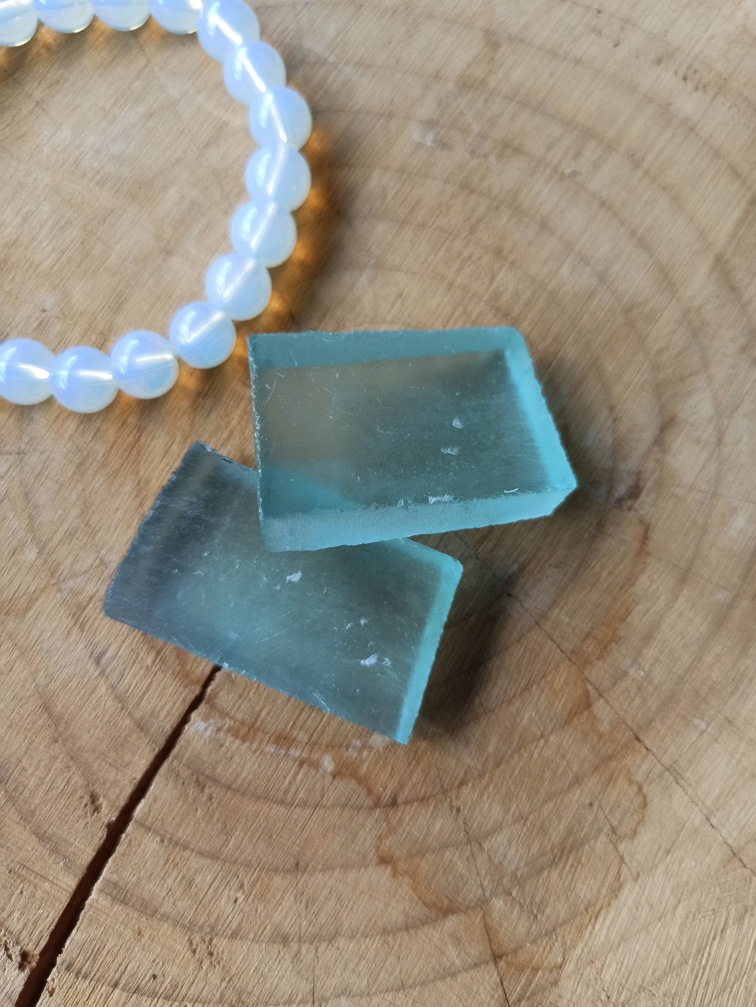 Andara obsidiaan trommelstenen – curated crystal by Marga Jacobs | rust, symboliek en intuïtieve zelfzorg