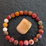 Petaliet trommelstenen – curated crystal by Marga Jacobs | rust, symboliek en intuïtieve zelfzorg